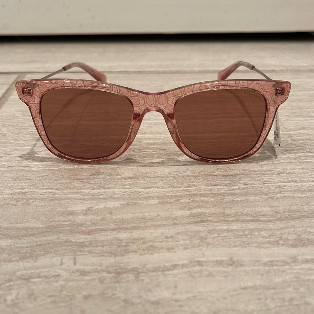 New with tags Coach sunglasses. Case, and cleaning cloth included.